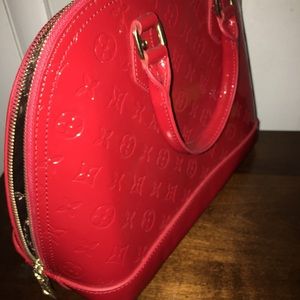 Louis Vuitton Alma Handbag